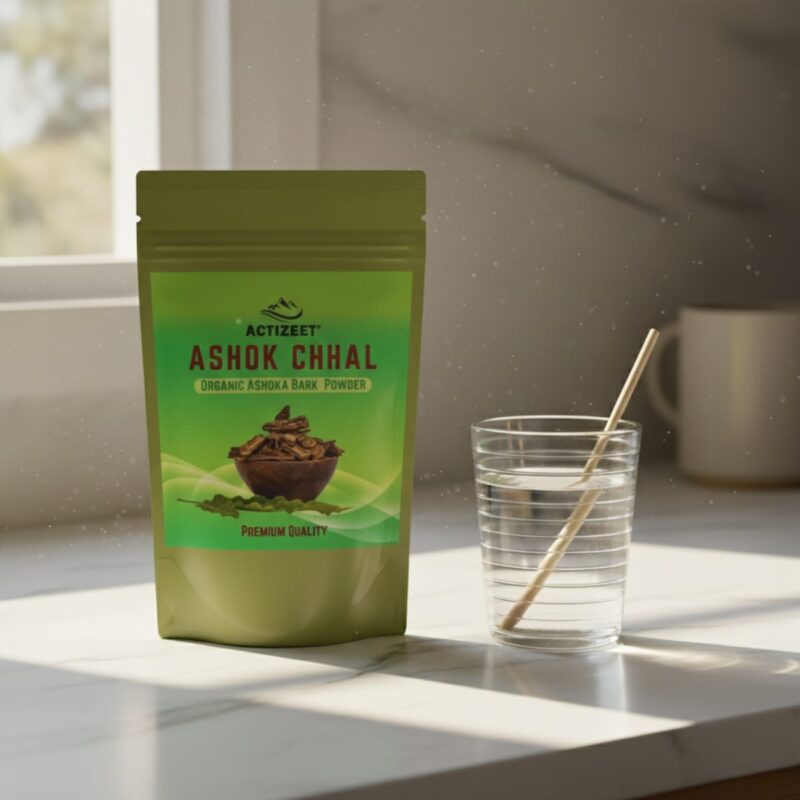 ACTIZEET pouch on marble counter with water glass and wooden stirrer in morning light.
