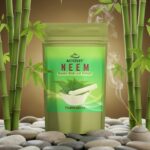 ACTIZEET neem powder on river stones with bamboo stalks