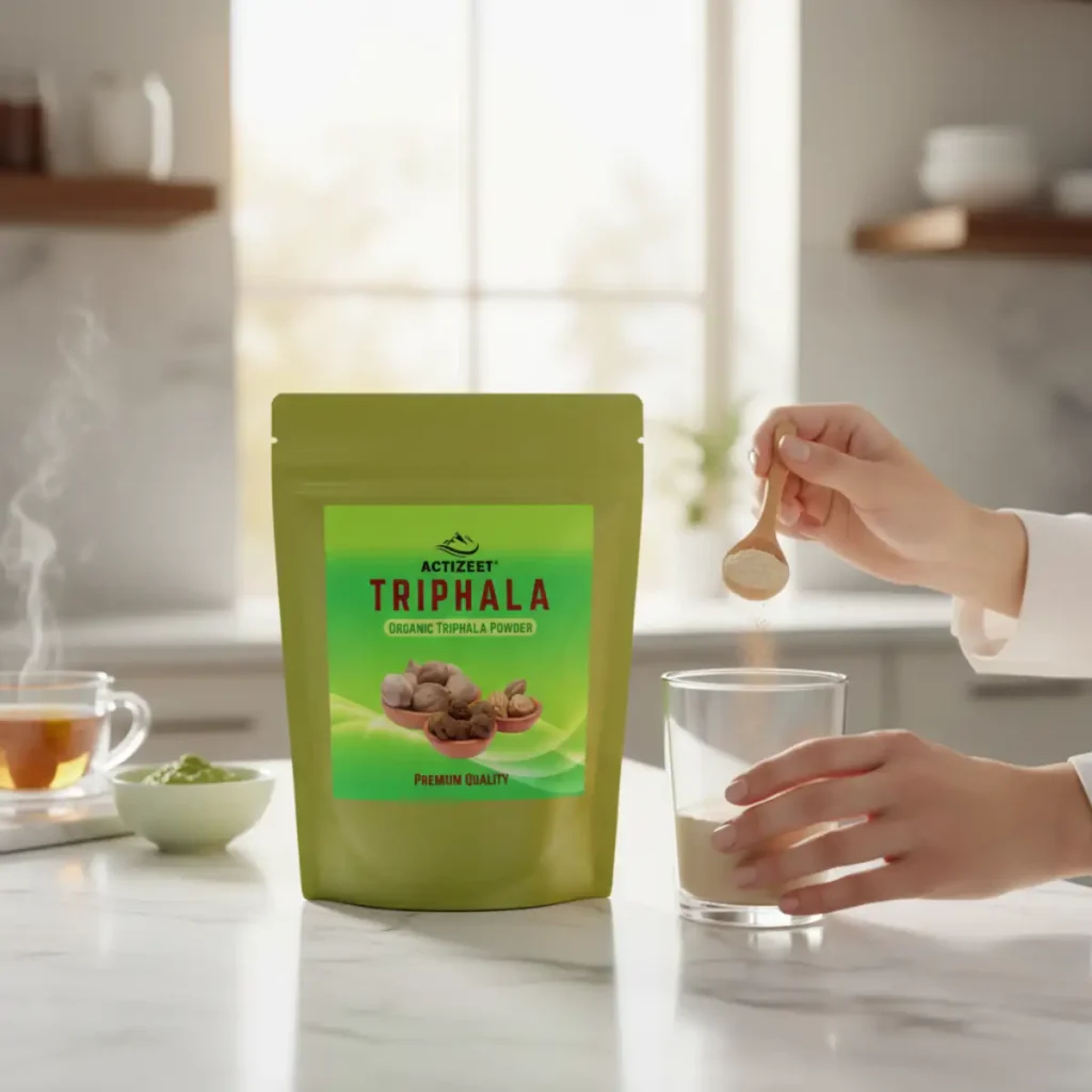 scooping triphala powder for digestion