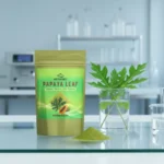 ACTIZEET Papaya Leaf Powder pouch on a glass laboratory table with fresh leaves in a beaker, clinical aesthetic