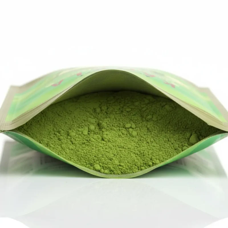 Close-up of fine green Karela powder texture inside an open ACTIZEET pouch