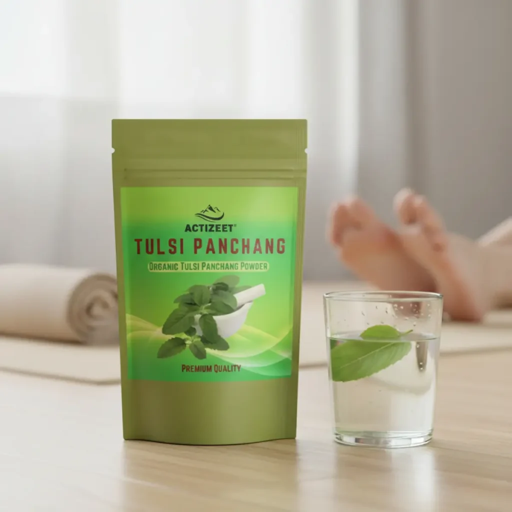 Focused shot of Tulsi powder and a glass of green water with a blurred yoga mat