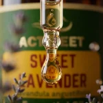 Close up amber glass dropper bottle lavender oil label